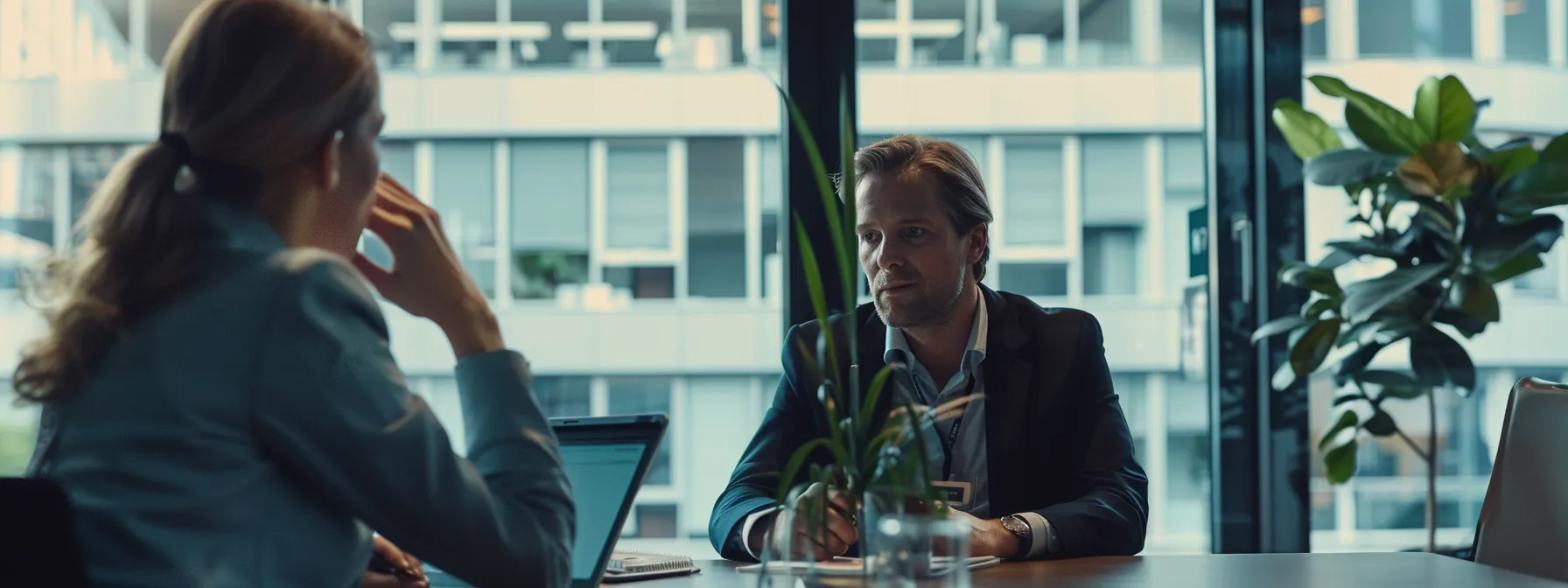 a finance broker discussing options with a client in a modern office setting.