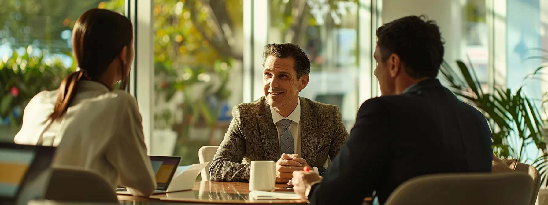 a finance broker discussing debt consolidation options with a real estate agent.